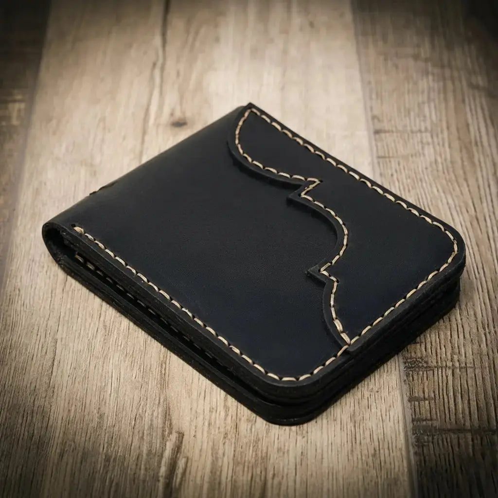 Black leather bifold wallet with contrast stitching and ornate flap detail.