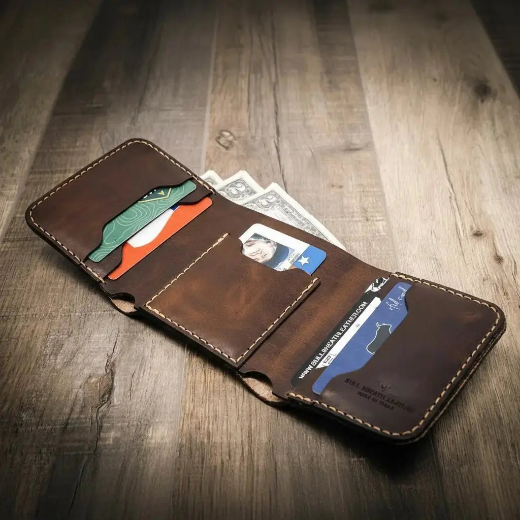 Brown leather trifold wallet with card slots and cash pocket