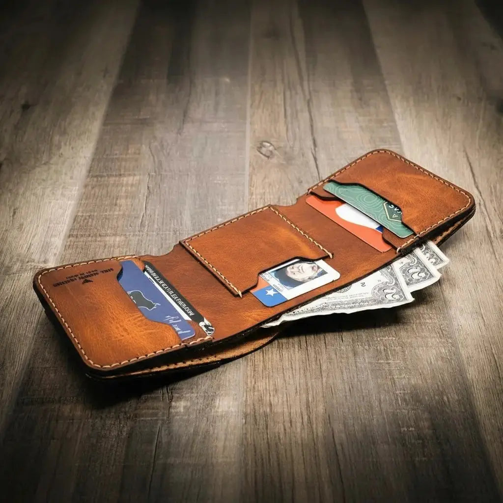 Brown leather trifold wallet with credit cards and cash.