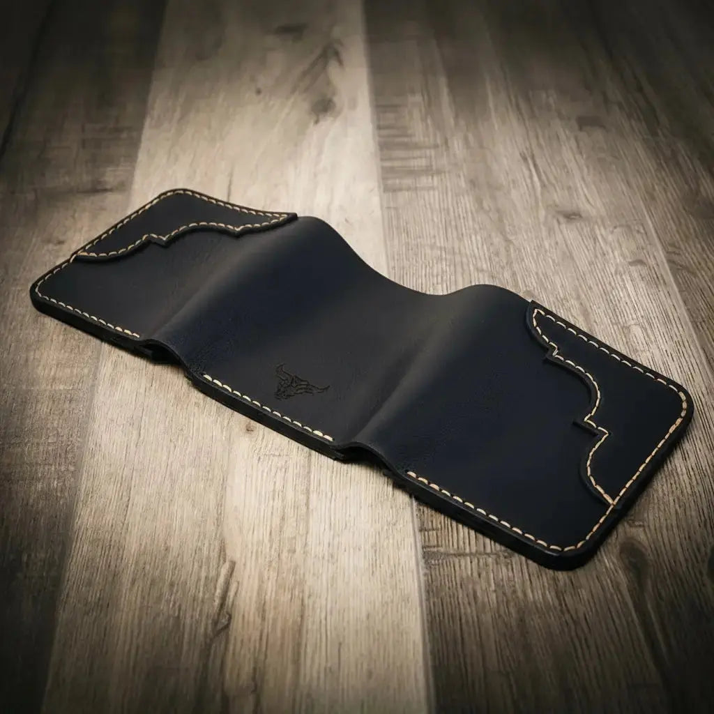 Black leather trifold wallet with decorative stitching and bull logo.