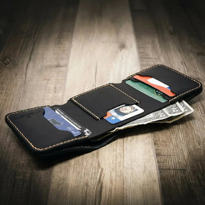 Black leather western trifold wallet with card slots and cash pocket.