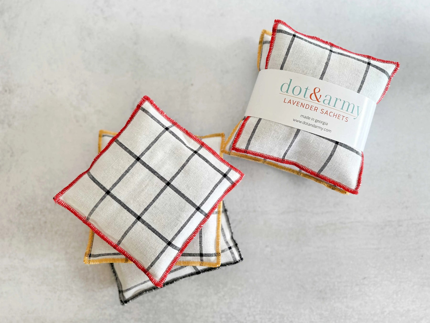 Windowpane linen lavender sachets in a set of two with red and yellow color trim.