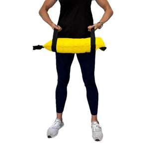 Yellow 20 lb workout battle bag made from recycled fire hose held by person