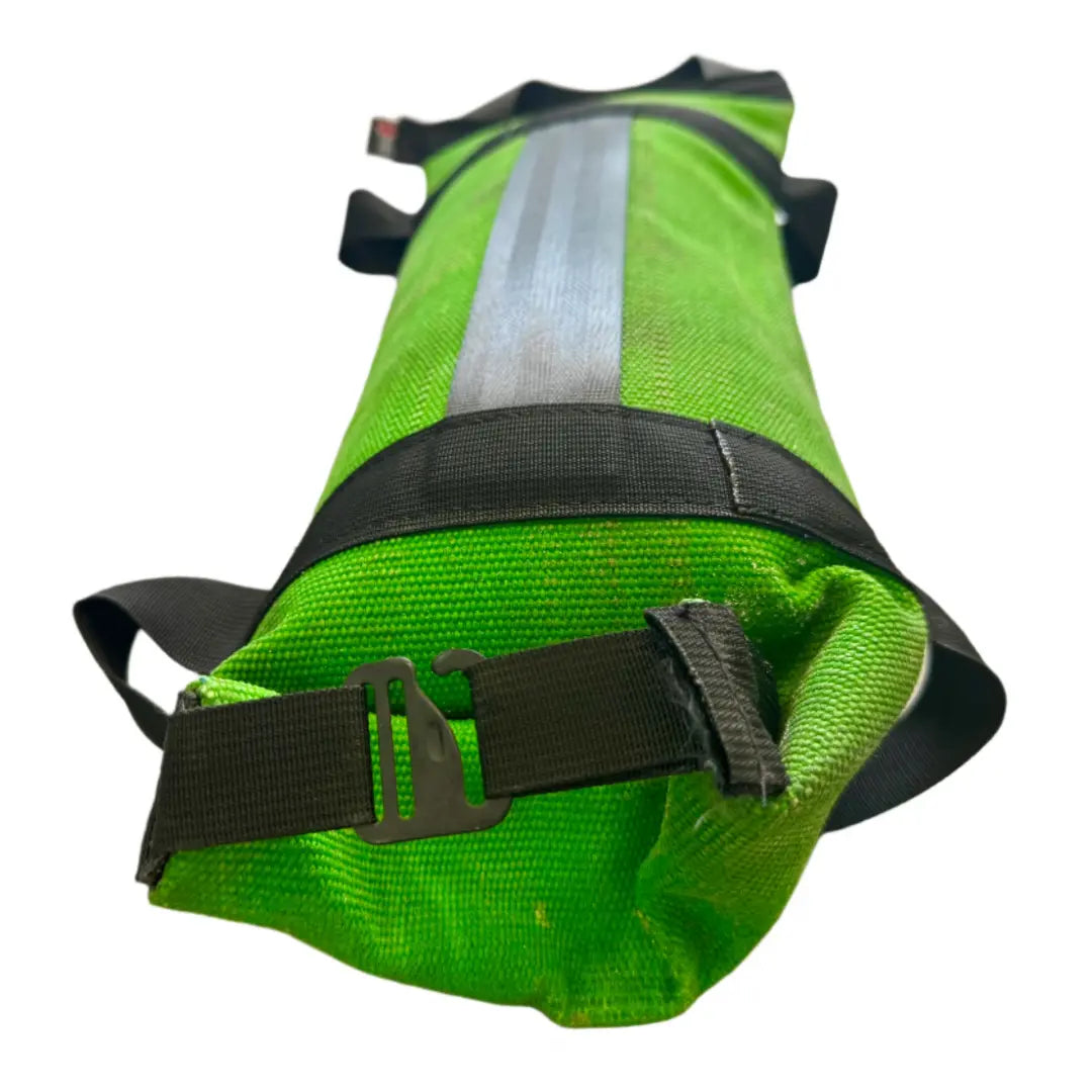Green workout battle bag made from recycled fire hose with reflective stripe and handles.