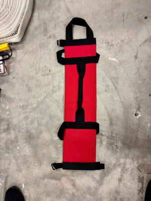 Red workout battle bag made from recycled fire hose with black handles.