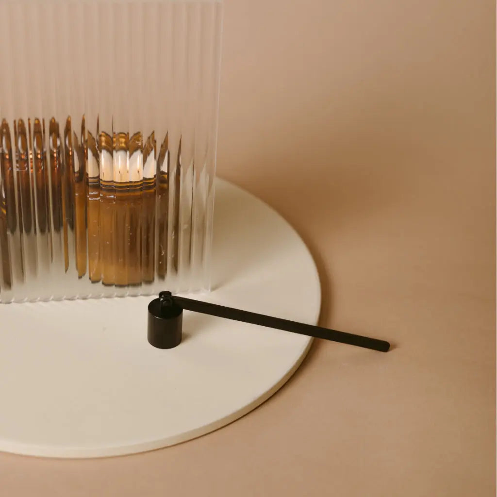 Candle snuffer by gold + ivy, scented candle main product photo