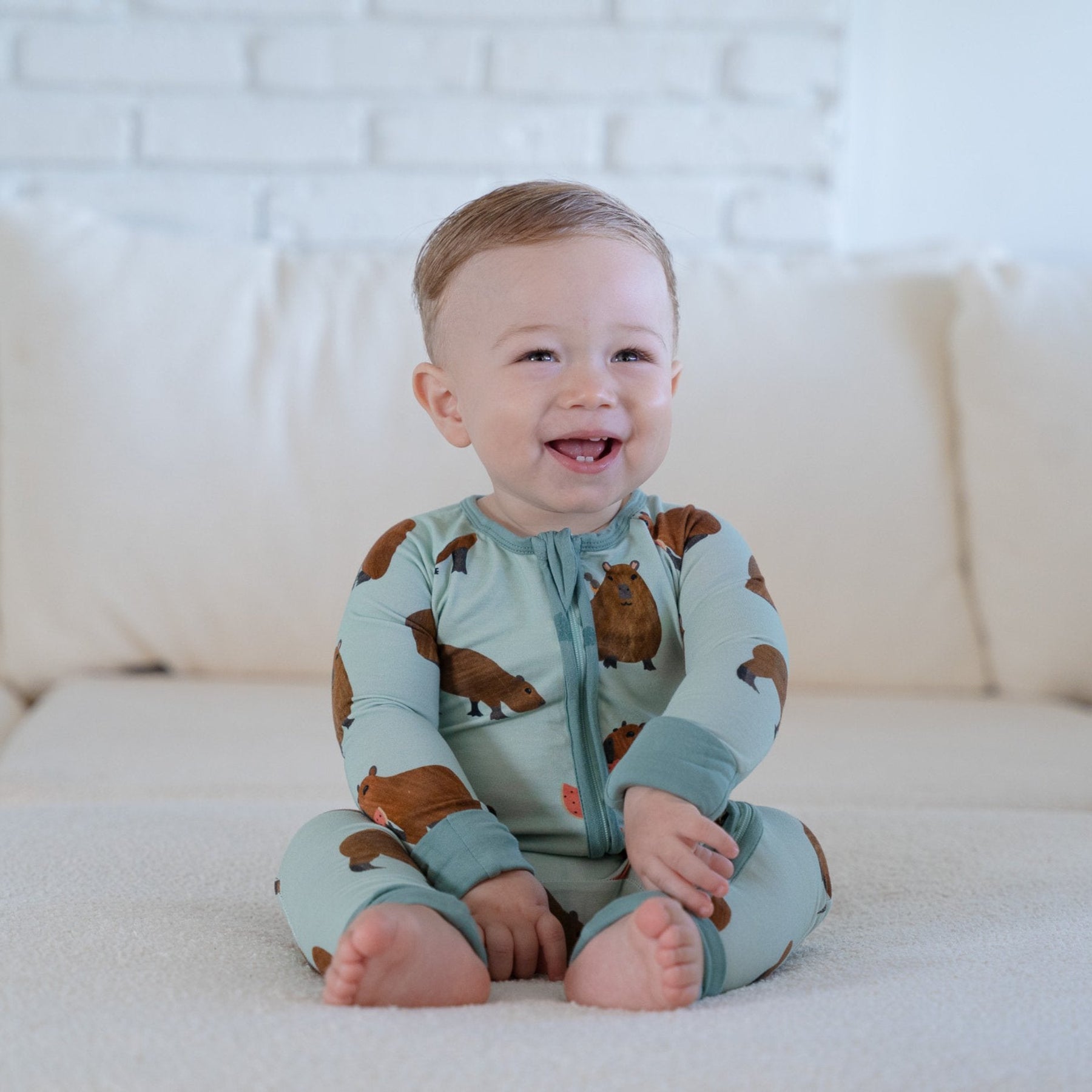 Additional view of Capybara bamboo baby zip pajamas with hand drawn animal print