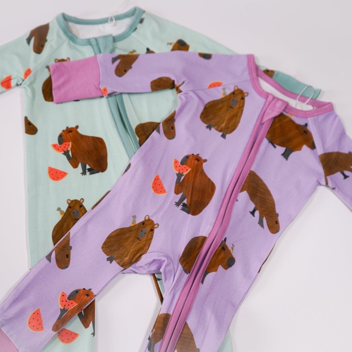Capybara bamboo baby zip pajamas with hand drawn animal print
