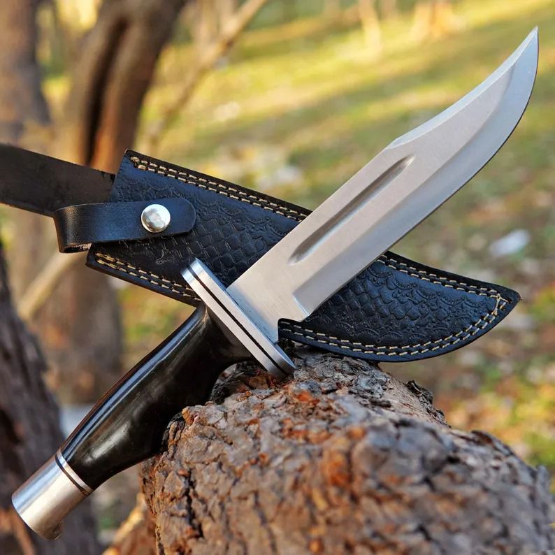 Blood Groove Hunting Knife with Dark Handle and Textured Leather Sheath