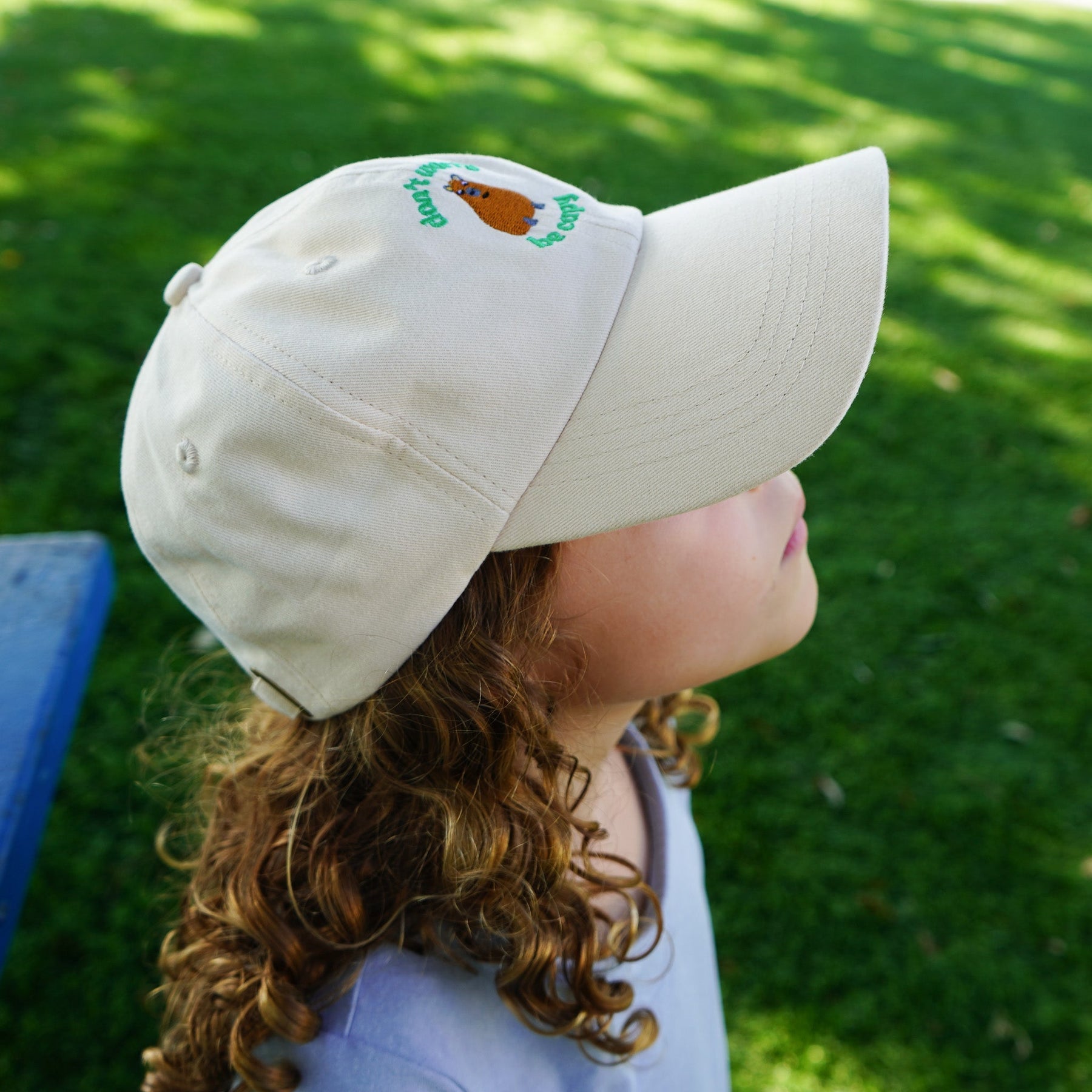 Additional view of Don't Worry, Be Capy embroidered baseball hat for kids and adults