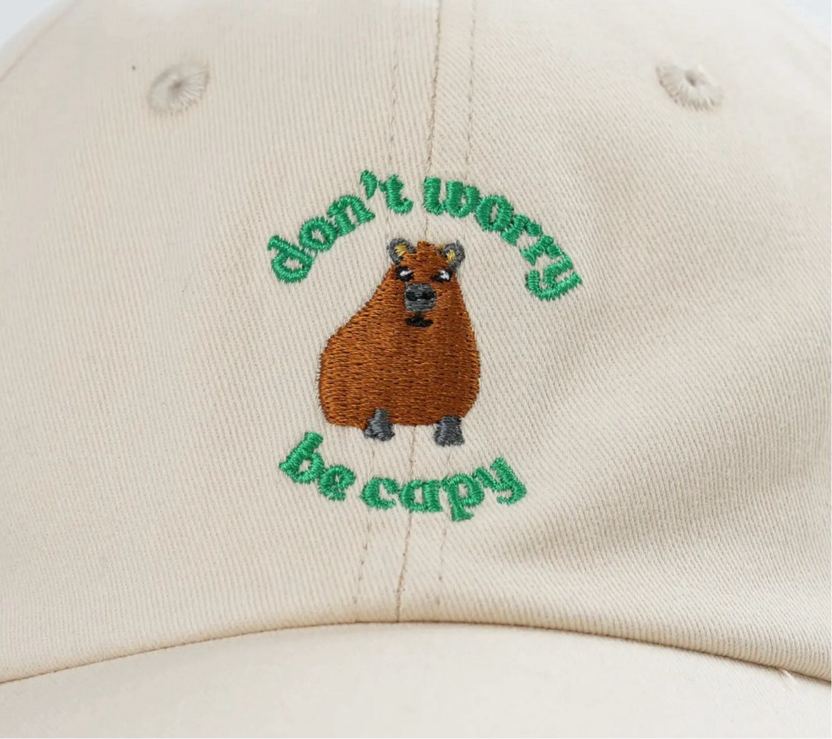 Additional view of Don't Worry, Be Capy embroidered baseball hat for kids and adults
