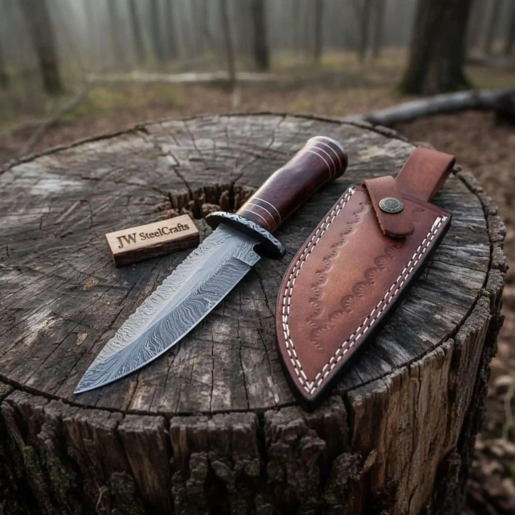 10 Inch Hand Forged Feather Damascus Steel Bowie Knife with Rosewood Handle and Leather Sheath by JW SteelCrafts, leather knife sheath main product photo