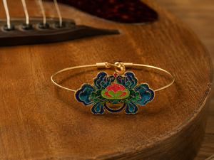 Decorative bracelet with floral design on a guitar's wooden surface