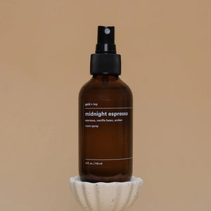 Gold + Ivy Midnight Espresso room spray in a dark amber glass bottle with white label.