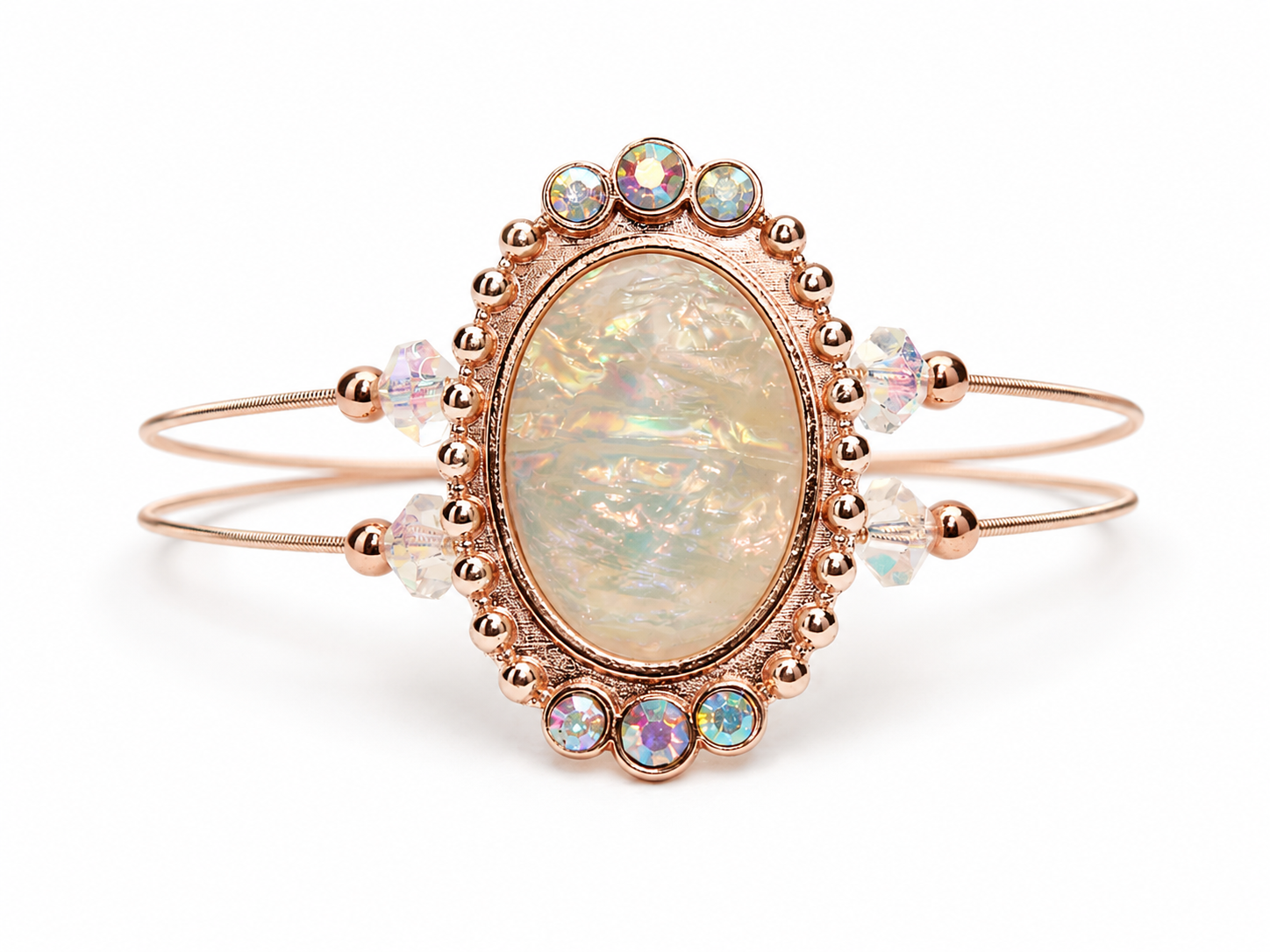 Rose gold bracelet with an opal stone and small crystals on a white background