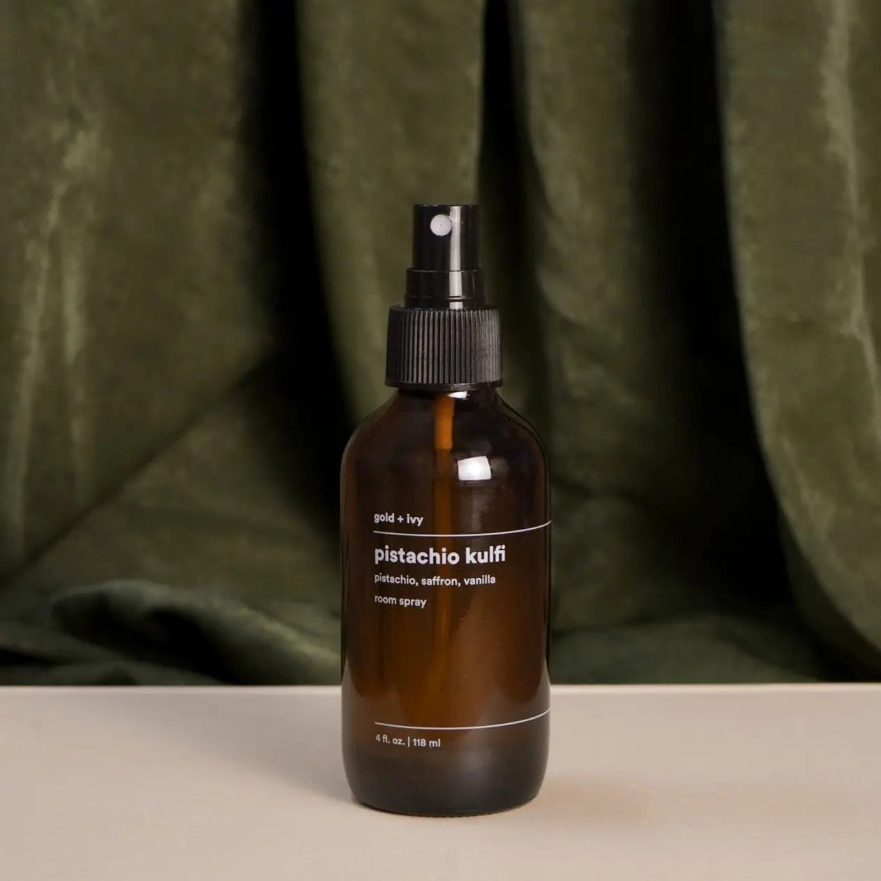 Pistachio kulfi room + linen spray by gold + ivy, scented candle main product photo