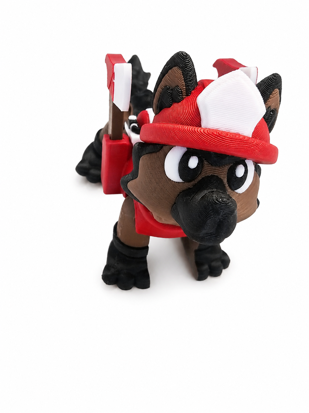 Close up of The Tween Space firefighter dog 3D printed toy showing the red fire helmet and cartoon dog face