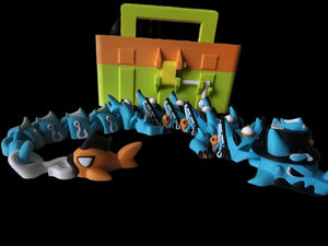 3D printed fishing dragon with tackle box isolated on a black background by The Tween Space
