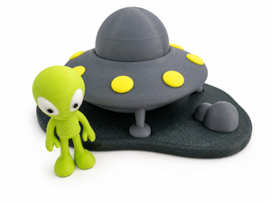 Close up of The Tween Space UFO space playset with a green character and gray spaceship details