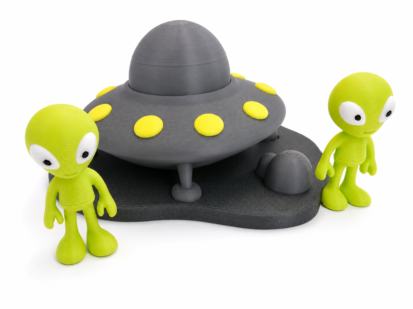 Front view of The Tween Space UFO space playset with green characters on a textured base