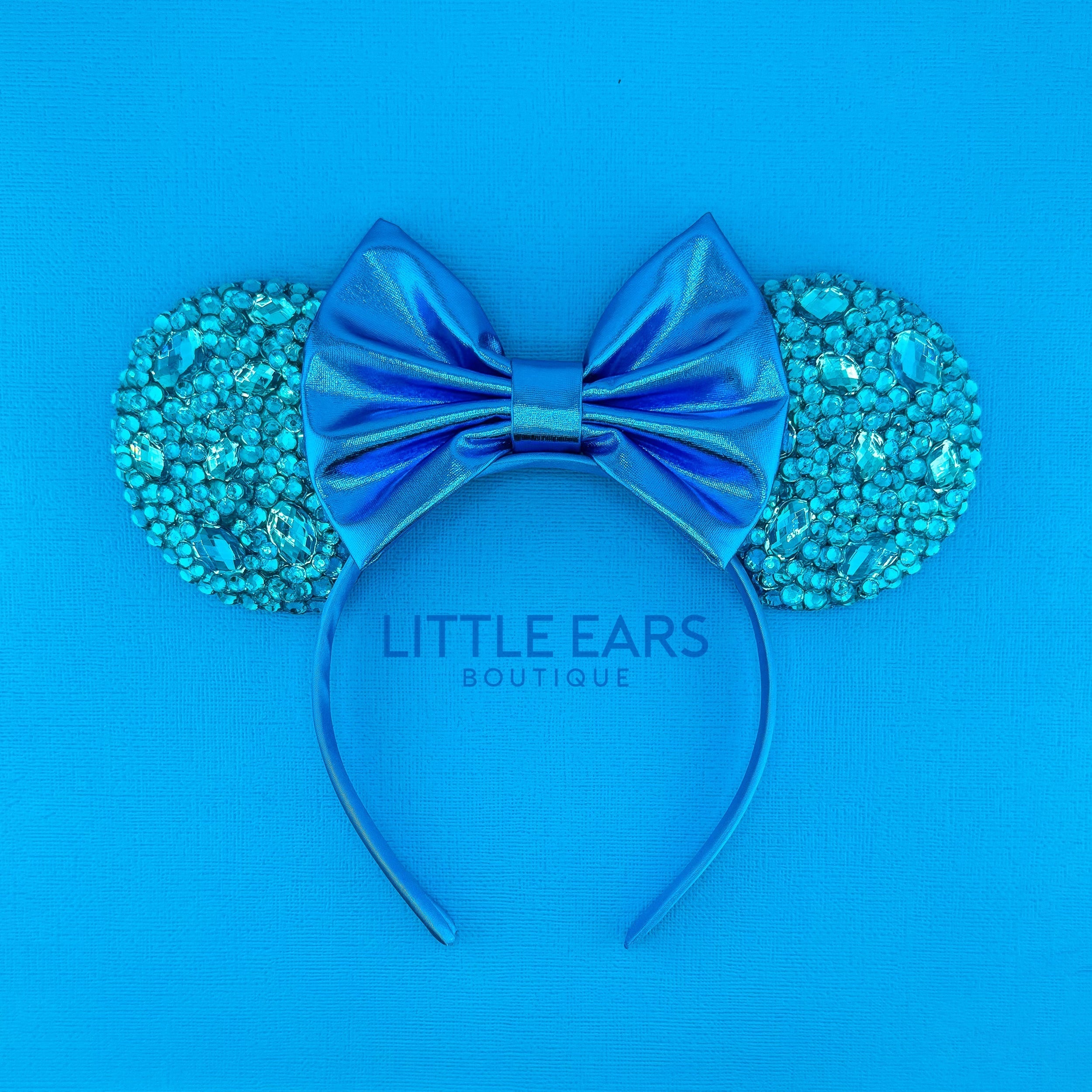 Turquoise Sparkle Ears by Little Ears Boutique, travel planning service main product photo