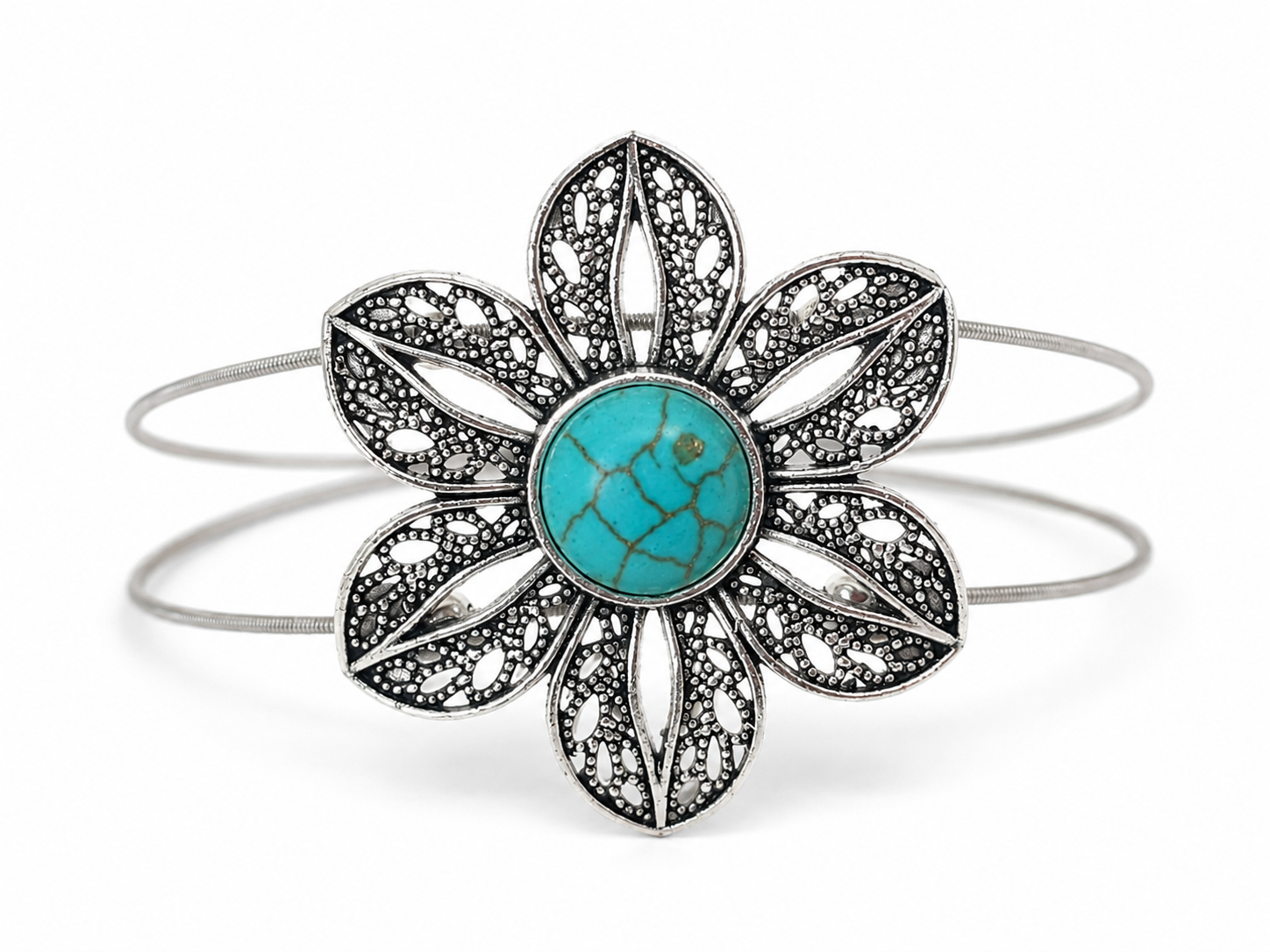 Floral bracelet with turquoise center and silver accents on a white background