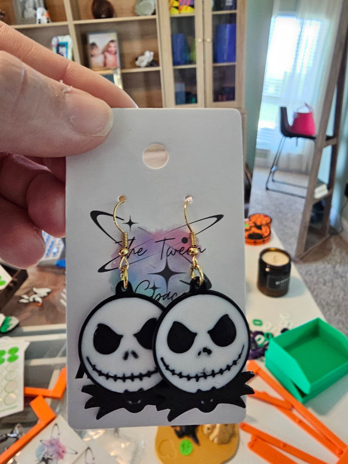 Finished Jack Skellington earring pair with gold-tone hooks on The Tween Space display card