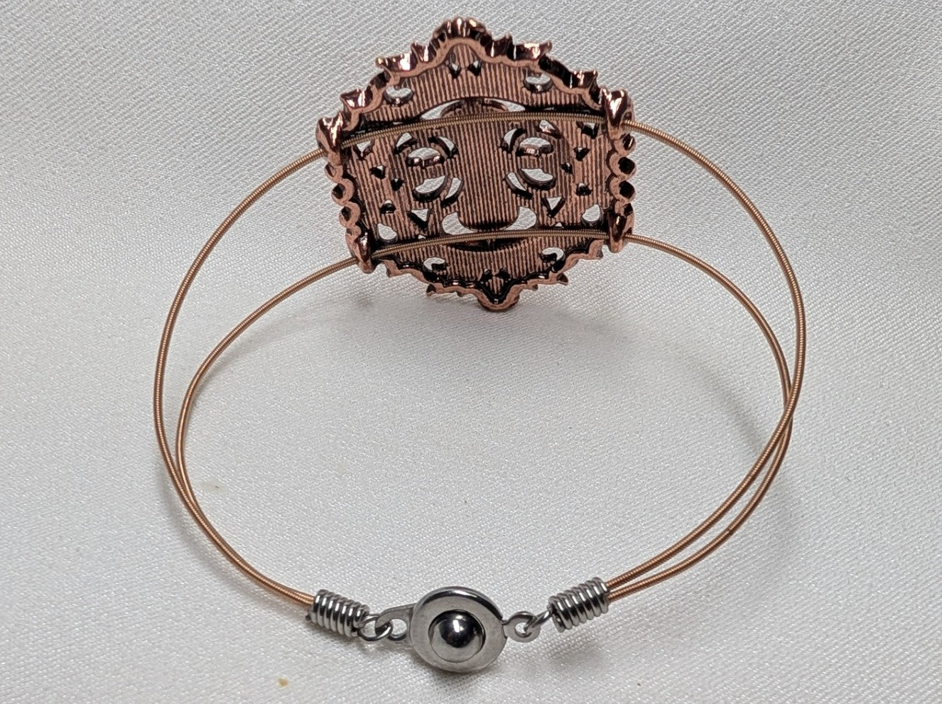 Copper rhinestone guitar string bracelet detail